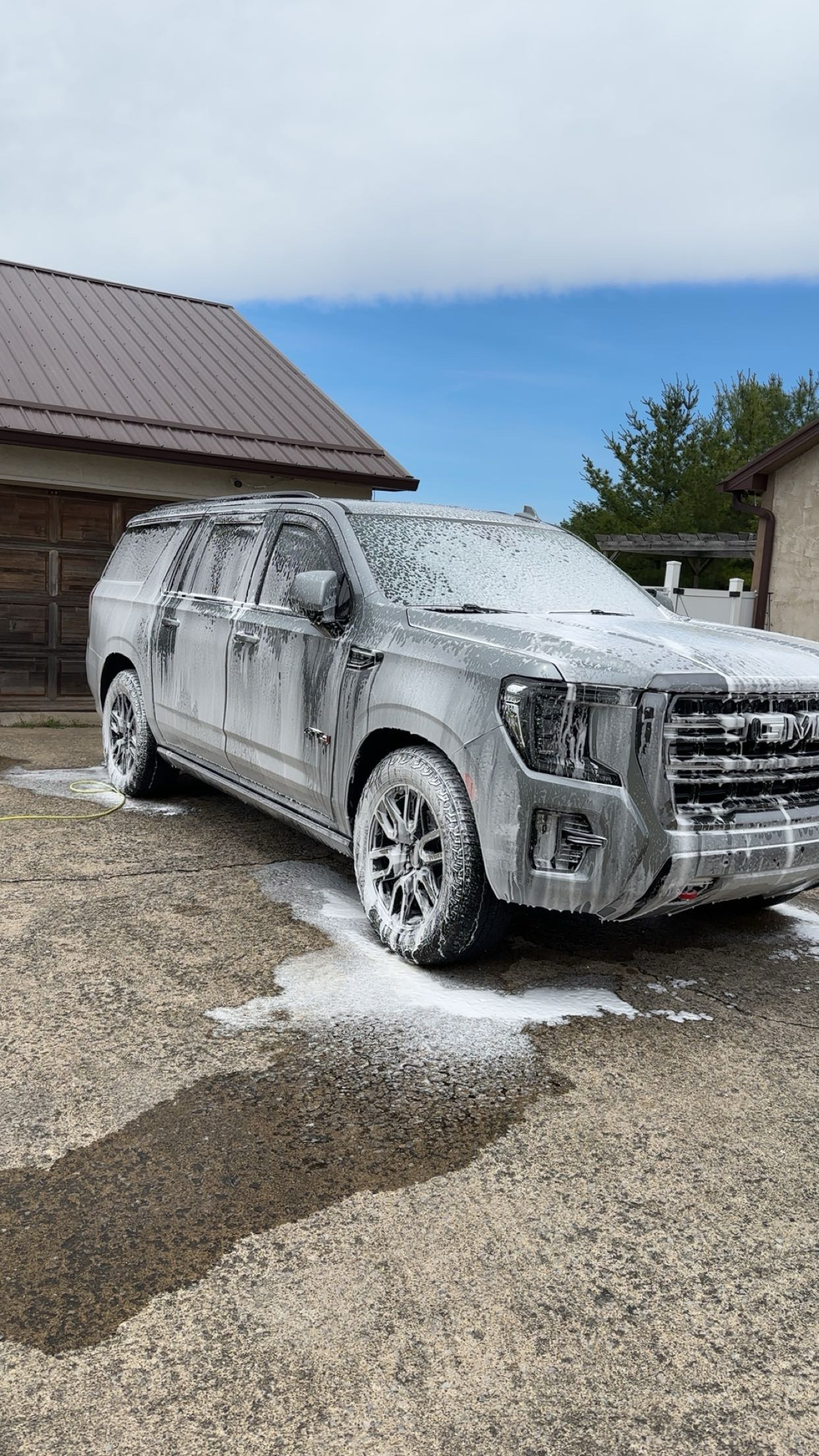 GMC exterior covered in soap during wash service