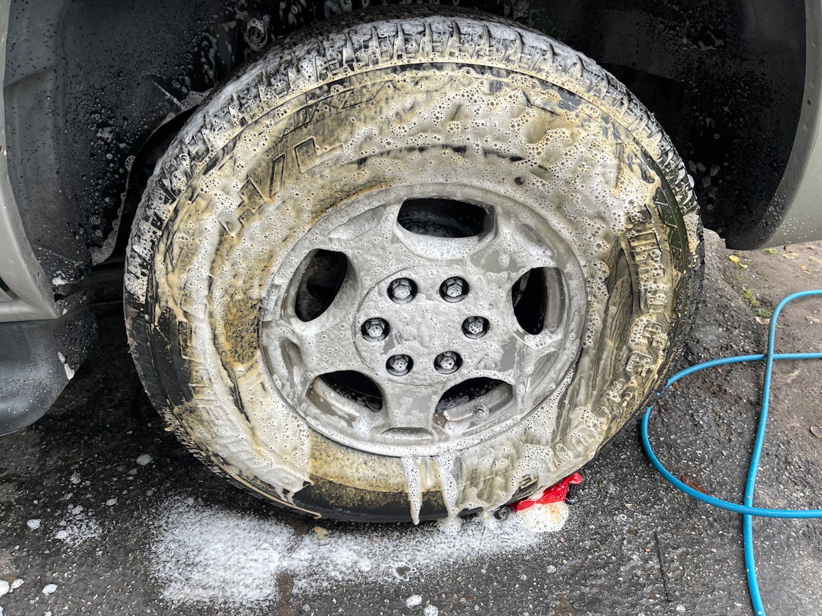 Wheel detail covered in cleaning foam